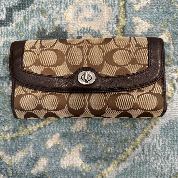Coach Handbags - NWOT Authentic Coach Original Pattern Large Wallet with Brown Accents.